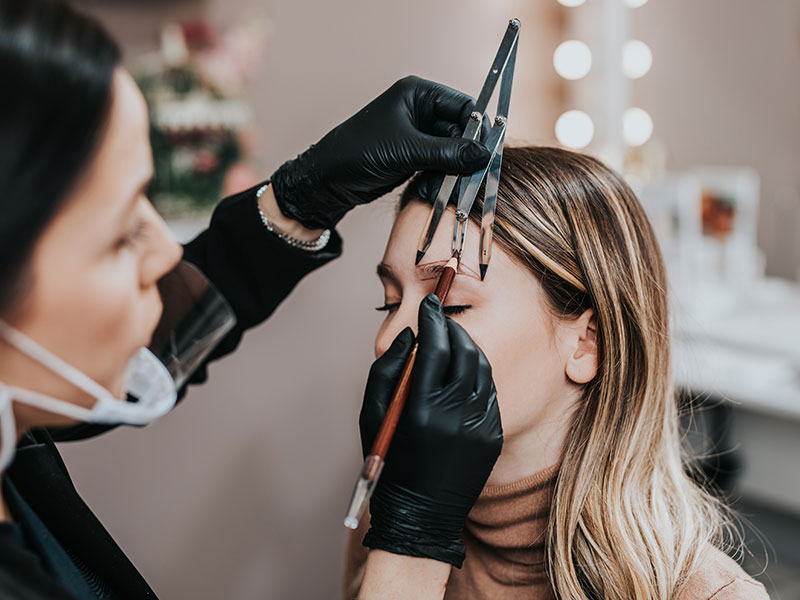 Micropigmentation Technician Taking Measurements